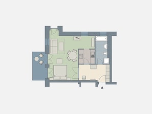 Un plan d’étage d’une chambre d’hôtel comprenant un espace de vie, une cuisine, une salle de bain et un petit balcon.