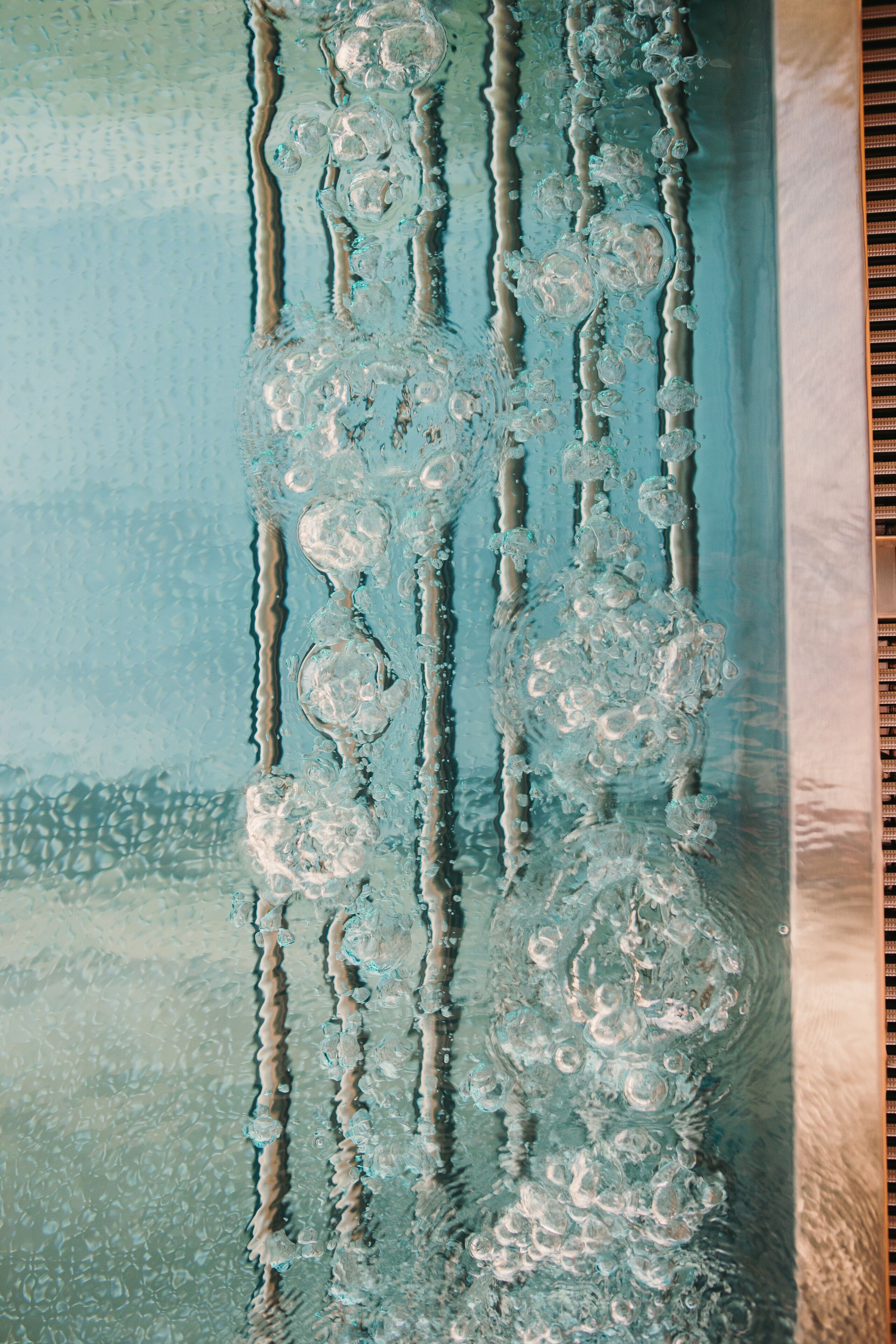 A close-up of a textured surface with a pattern of bubbles and ridges.