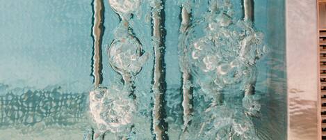 A close-up of a textured surface with a pattern of bubbles and ridges.