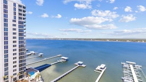 A high-rise hotel with a marina and dock area. - Lagoon Front corner unit with lagoon and gulf views! 11th floor 3 bed 3 bath (Gulf Shores)