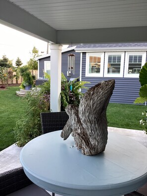 A patio with a round table and a decorative rock centerpiece. - Brand new listing this season
Hickory Lakehouse (Wheatley)