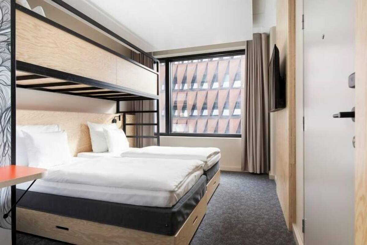 Premium bedding, desk, laptop workspace, blackout curtains