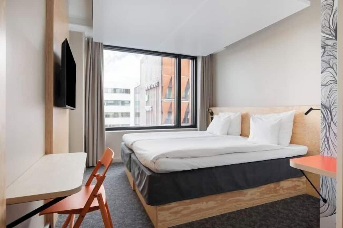 Premium bedding, desk, laptop workspace, blackout curtains