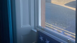 A room with a view of a rocky coastline through a window. - Stunning sea views, dog friendly holiday accommodation in North Berwick (North Berwick)