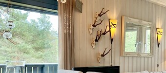 Cozy vacation home in southern Norway (Tromøy, Arendal) with a boat and a pier.