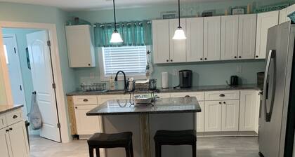 Upstairs 3 BR, 2 bath home, 150 yds from beach with beautiful clear water.