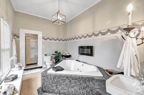Bathtub, jetted bath, hair dryer, towels