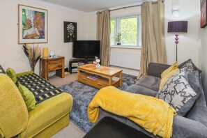 Apartamento | Área de estar | TV 30 polegadas com canais a cabo