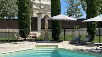 Seasonal outdoor pool, pool umbrellas, pool loungers