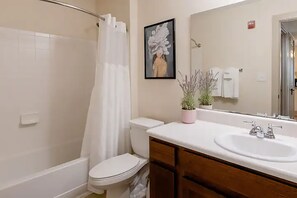 Combined shower/tub, hair dryer, towels, soap