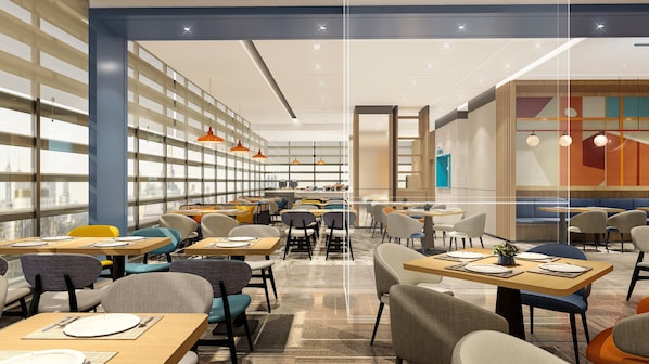 A modern library-style restaurant with high ceilings, large windows, and a variety of seating arrangements. - Holiday Inn Express Chongqing Caiyun Lake by IHG (Chongqing)
