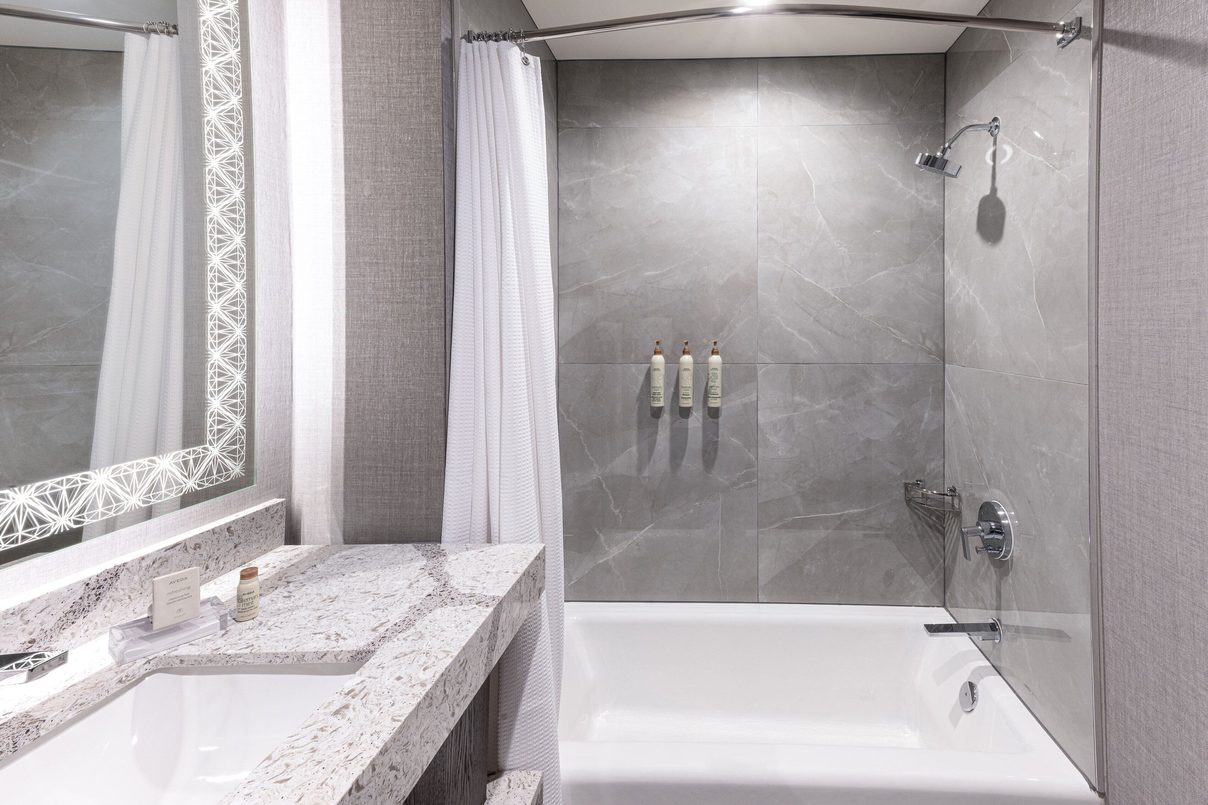 designer toiletries, hair dryer, towels