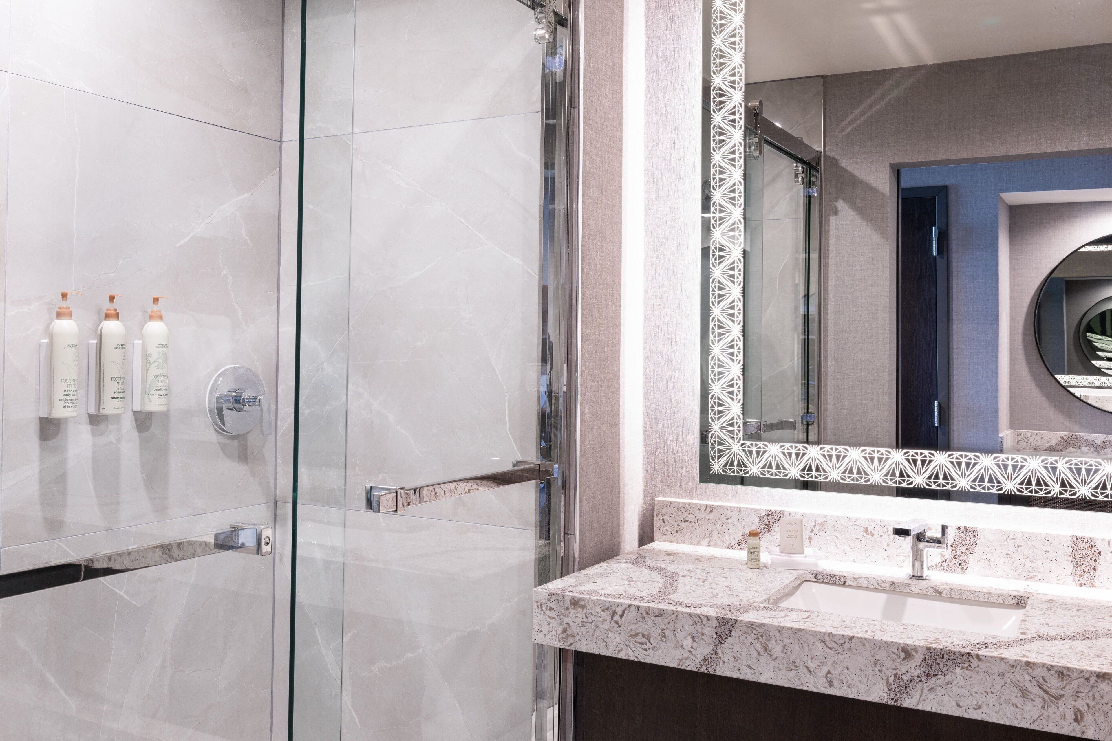 designer toiletries, hair dryer, towels