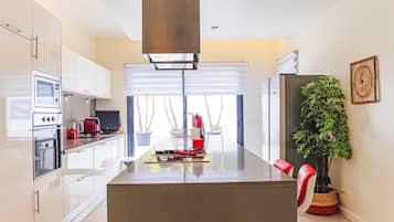 Villa | Private kitchen | Fridge, microwave, oven, stovetop