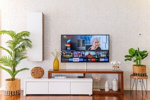 Villa | Living area | 30-inch TV with cable channels, fireplace