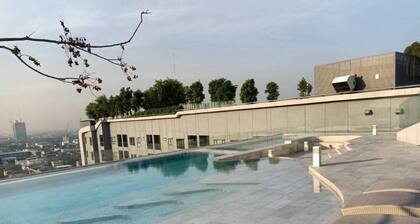 High Rise condominium with outdoor pool with view on rooftop.