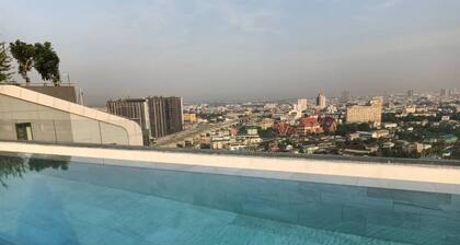High Rise condominium with outdoor pool with view on rooftop.