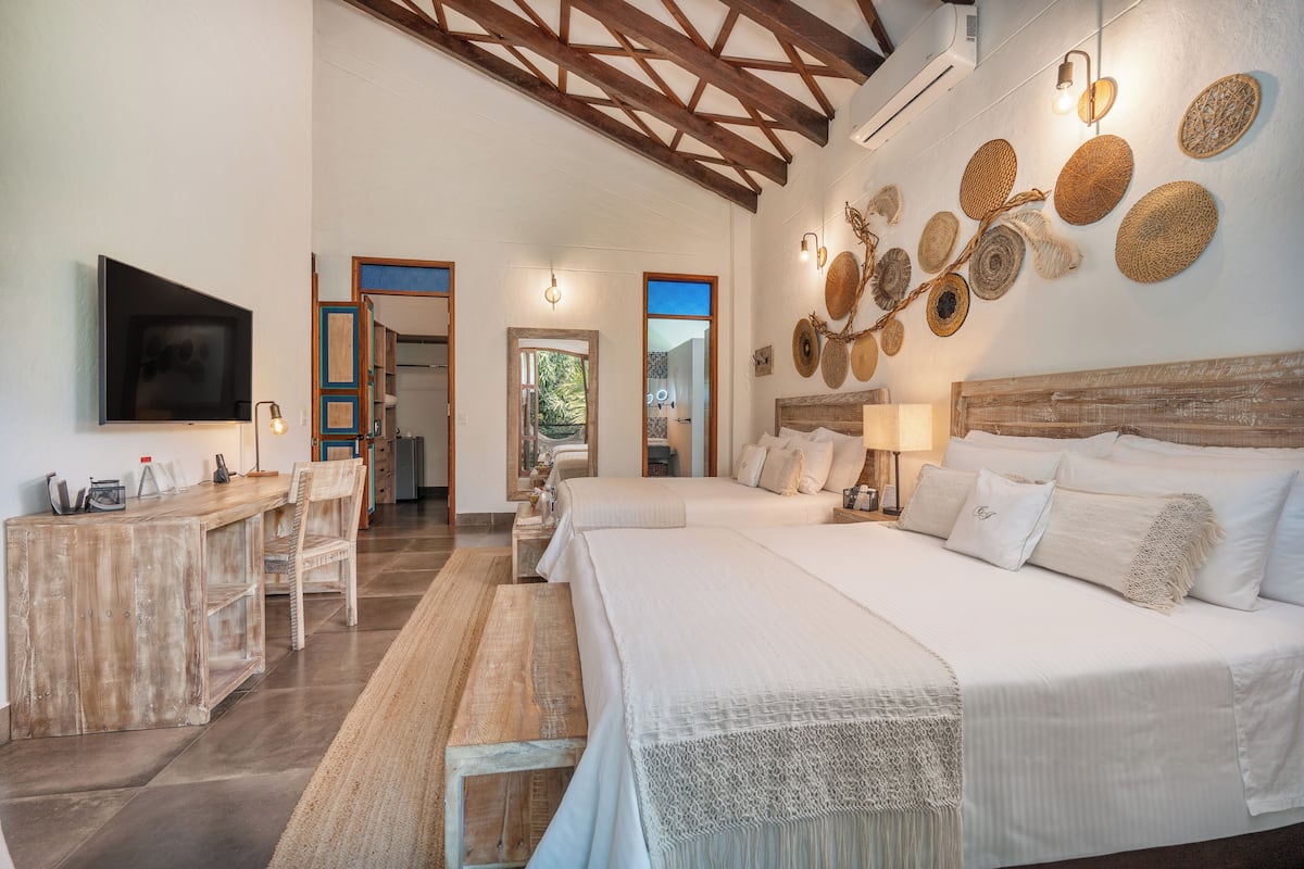 Quadruple Room, Balcony | Down comforters, free minibar, in-room safe, desk