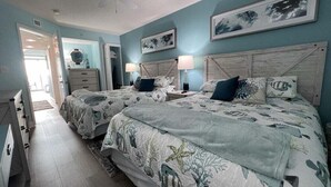 A bedroom with two beds, a dresser, and a ceiling fan. - HS-0507 Oceanfront 1-BR Condo in Myrtle Beach, 652 sq ft of coastal comfort for up to 6 guests. (Myrtle Beach)