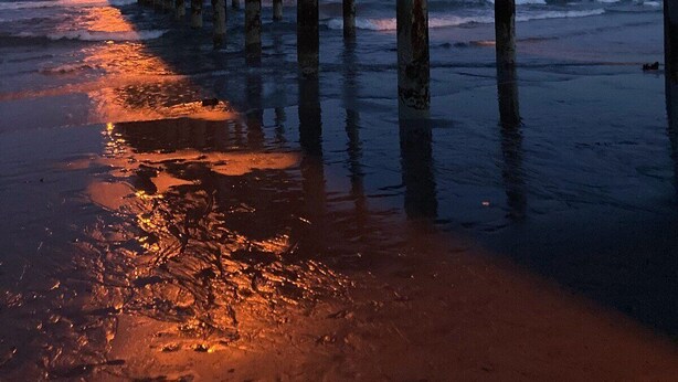 A pier extending into the water with a wooden walkway and street lamps. - HS-0507 Oceanfront 1-BR Condo in Myrtle Beach, 652 sq ft of coastal comfort for up to 6 guests. (Myrtle Beach)