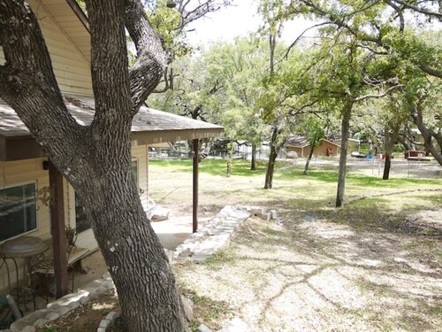 house and lighted deck fenced yard
   