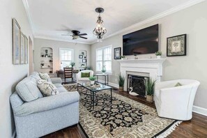 Smart TV, fireplace, books, offices