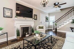 Smart TV, fireplace, books, offices