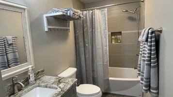 Combined shower/tub, hair dryer, towels, soap