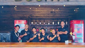 A bar area with a sign reading "BOUNTY" above a shelf of liquor bottles. - Sailors Beach Fiji (Nadi)