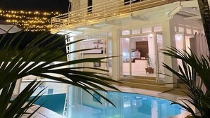 A two-story building with a swimming pool in the foreground. - Sailors Beach Fiji (Nadi)