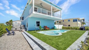 A two-story house with a swimming pool, a covered patio, and a small deck. - Dock, Pool, FREE RAMP, Kayaks, Jacuzzi, Amazing Ocean Views Pets are Welcomed! (Marathon)