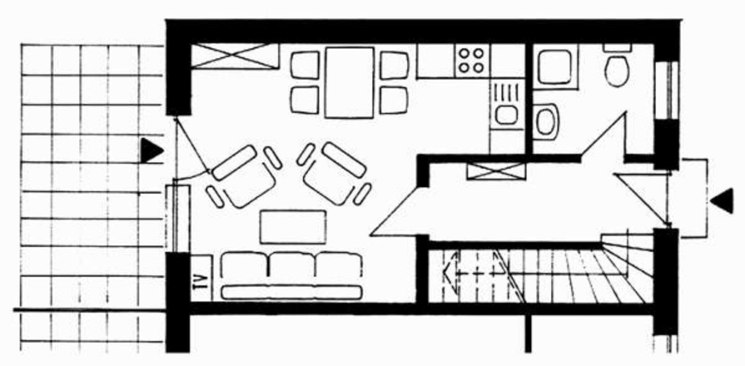 A floor plan of a hotel room with a TV, sofa, and a small kitchen area.