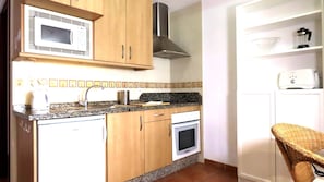 Microwave, oven, dining tables