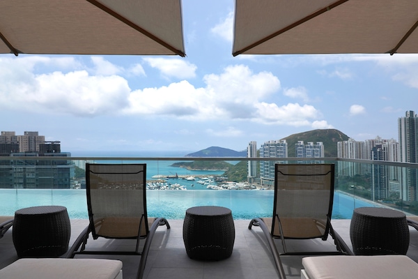 Seasonal outdoor pool, open 8:00 AM to 7:00 PM, pool umbrellas