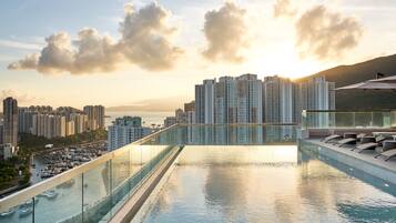 Seasonal outdoor pool, open 8:00 AM to 7:00 PM, pool umbrellas