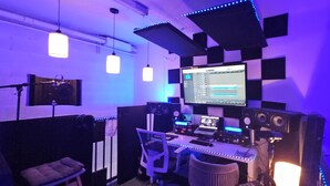 A recording studio with a computer, speakers, and a mixing console. - Artist Housing - Hostel (Los Angeles)