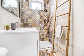 Shower, hair dryer, towels, soap