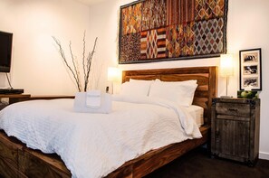 Relax in comfort with a large bed, bedside tables, and ample storage.