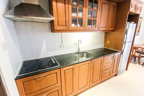 Condo, 1 Bedroom | Private kitchen | Microwave, electric kettle, dining tables
