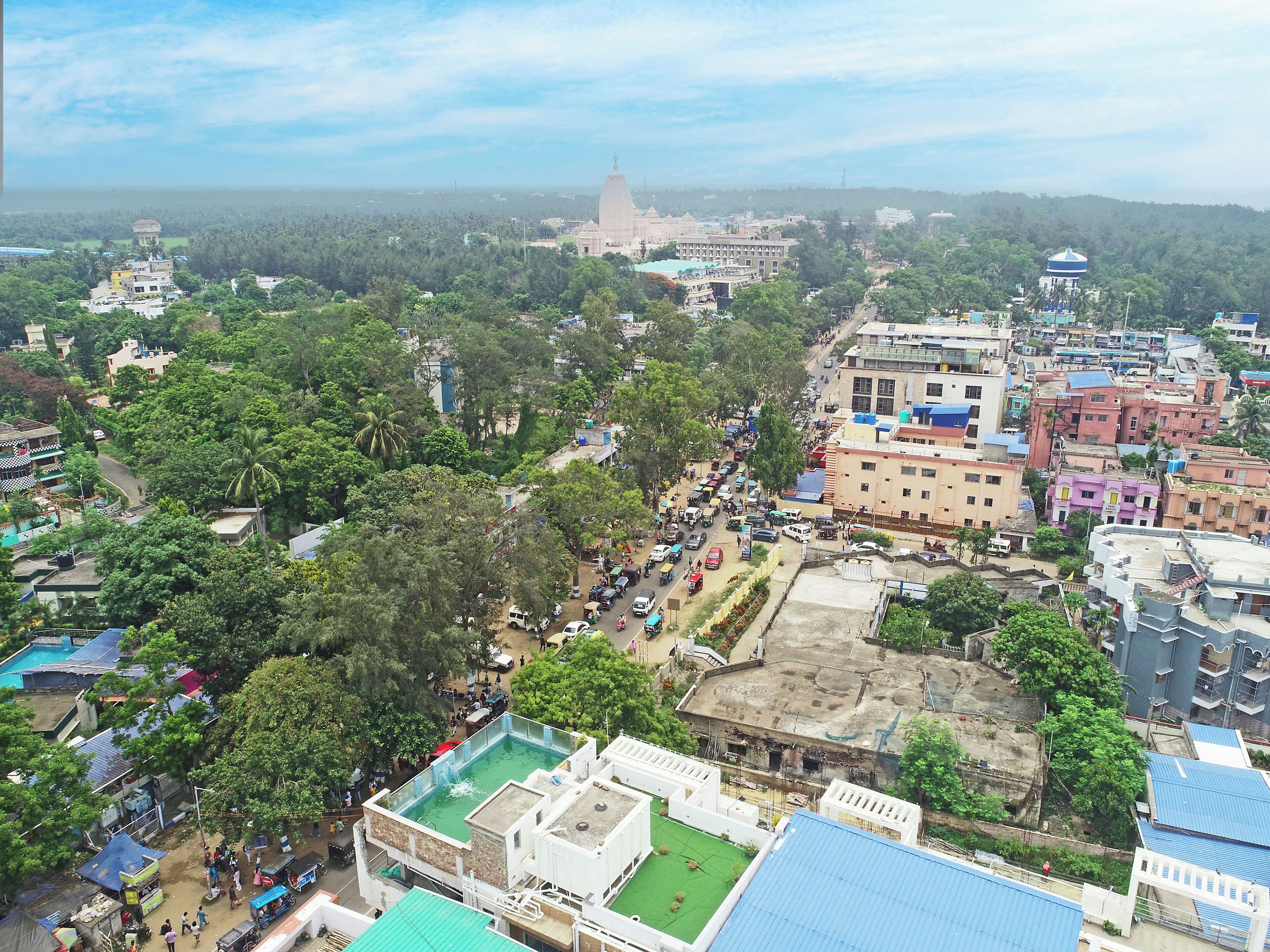 A densely populated urban area with various buildings, including a prominent dome-shaped structure in the distance.