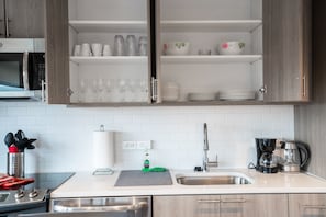 Enjoy cooking and dining in this well-lit kitchen with appliances and ample storage.