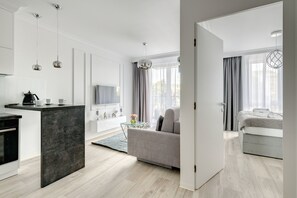Deluxe-Apartment | Wohnzimmer | 49-Zoll-LED-Fernseher mit Kabelempfang, Fernseher