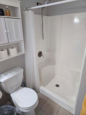 Combined shower/tub, hair dryer, towels, soap