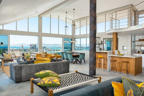 Luxury Penthouse | Living area | 32-inch flat-screen TV with satellite channels, TV