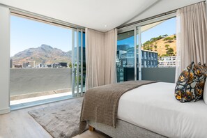 Penthouse de lujo | Ropa de cama de alta calidad y tabla de planchar con plancha
