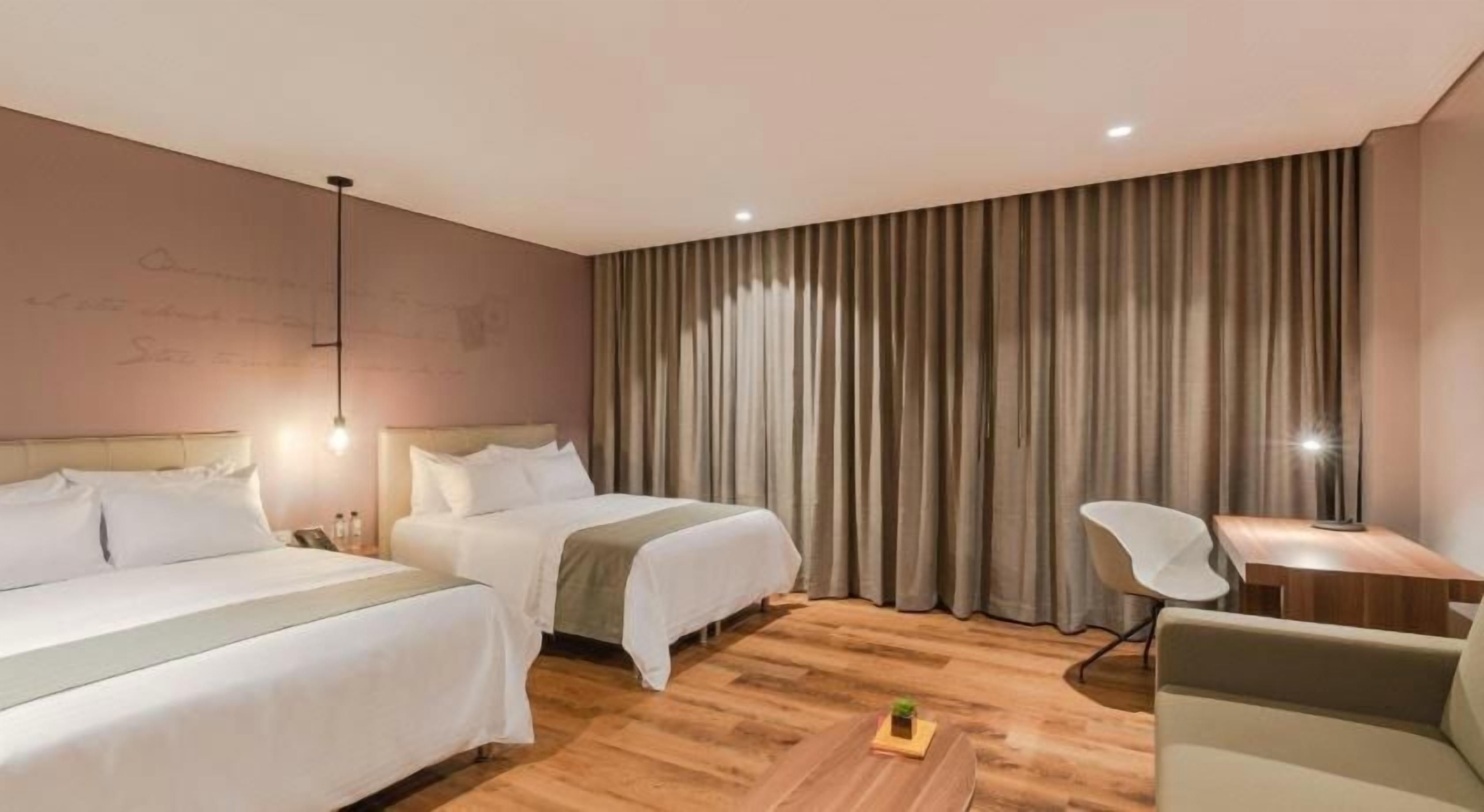 Hypo-allergenic bedding, pillowtop beds, minibar, blackout drapes