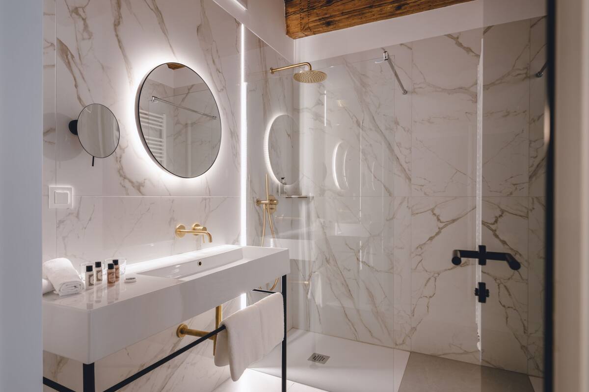 superior double room | bathroom | shower, rainfall showerhead, eco-friendly toiletries, hair dryer