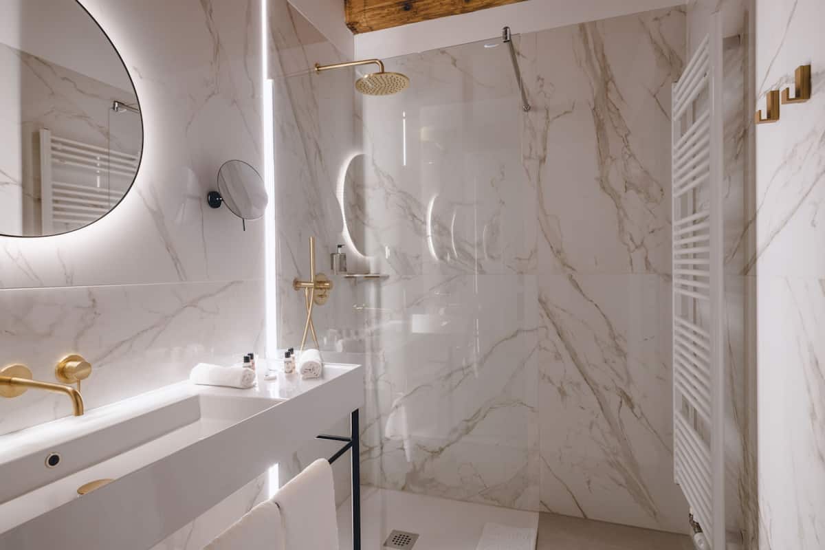 superior double room | bathroom | shower, rainfall showerhead, eco-friendly toiletries, hair dryer