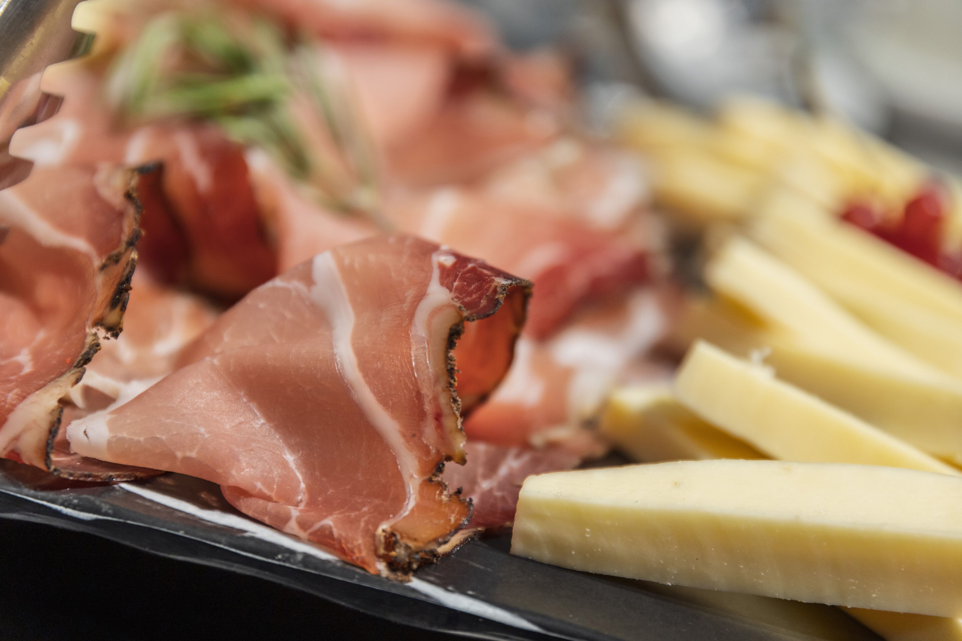 A platter of cured meats and cheese.