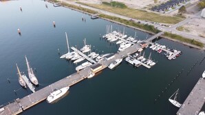 An aerial view of a marina with multiple docks and boats. - Vacation home Captains Hus directly on the Baltic Sea beach (Kappeln)